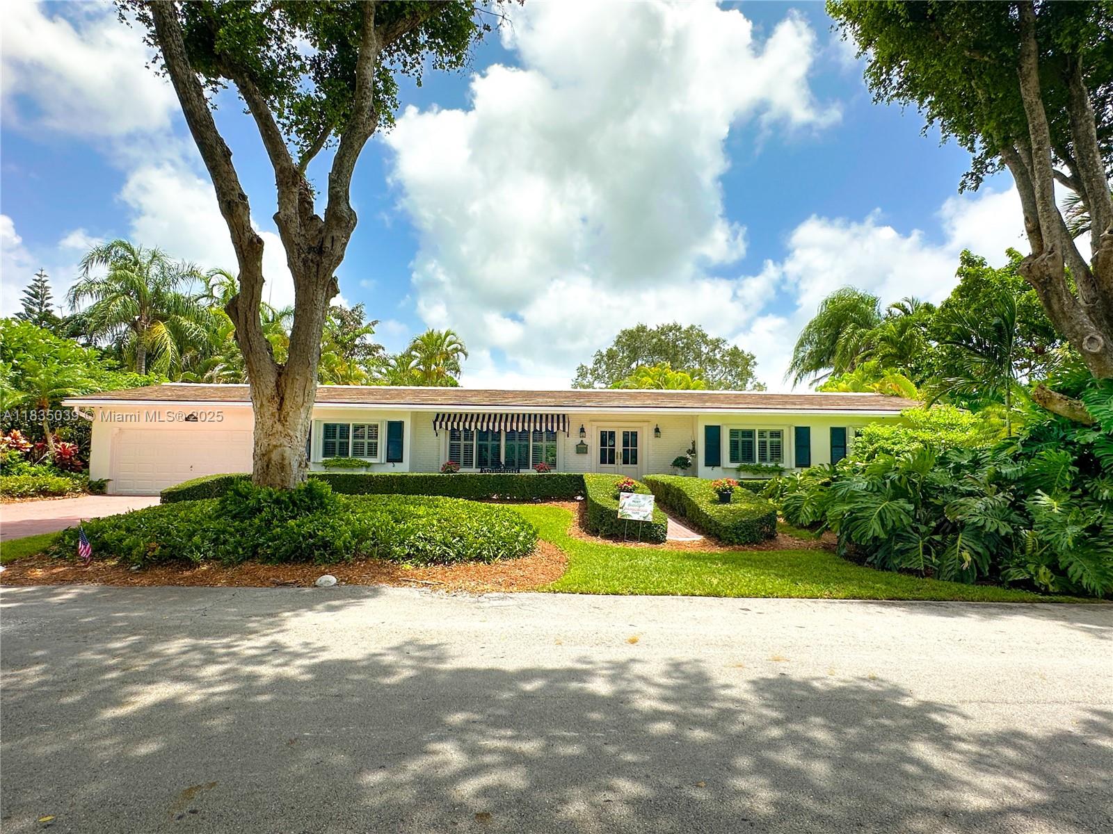Renovated 3BD/2BA home in Palmetto Bay’s desirable Mangowood community. Features include new roof (2024), impact windows/doors (2025), epoxy-lined cast iron pipes (2024), whole-house propane generator (2025), CCTV security, and 2-car garage. Kitchen updated with new Samsung appliances. Light-filled family room opens to screen-enclosed patio and resurfaced pool. Award-winning tropical landscape includes exotic plants, orchids, jasmine, ferns, and avocado tree. Zoned for A-rated schools: Coral Reef Elem., Southwood Middle, and Palmetto Senior High. Minutes from Deering Estate, Black Point Marina, parks, trails, dining & more. Move-in ready!