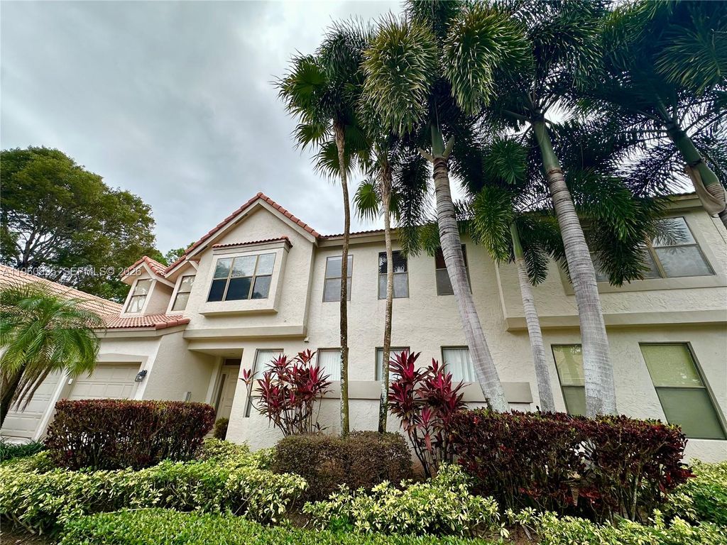 Photo of 5790 Coach House Cir #E, Boca Raton, FL 33486 (MLS # A11960925)