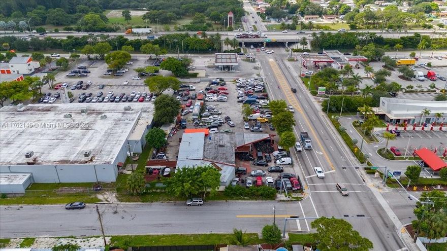 Current use is automotive repair and sales. As per owner, property is approved for low-income housing up to 84 units. Current zoning is BU13 (Business use). Square feet provided includes lot next door (to south) and included in sale. Price includes two folios. Property is zoned for PCD-Planned Corridor Development.