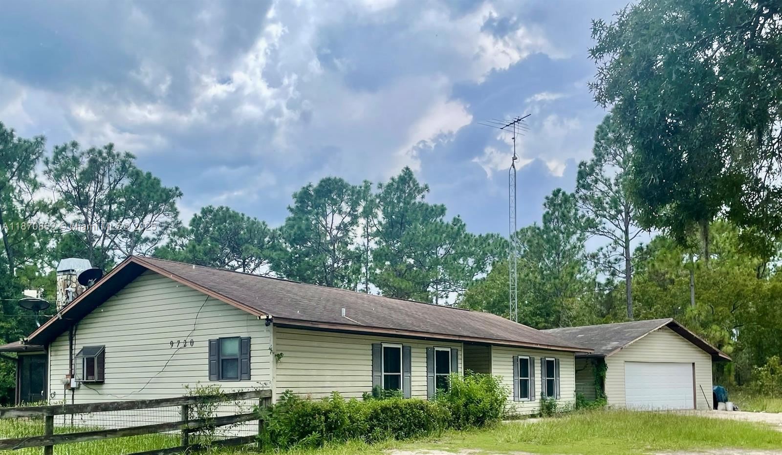 Single-family home with lots of potential! It is situated on a 4.38 acre corner lot in Dunnellon, FL in Marion county zoned residential and agriculture. It features paved roads and detached 2-car garage, hurricane impact windows, alarm system, fireplace, screened patio, cooking island in kitchen, 1 bath with accessible shower and 1 bath with tub/shower combination, laundry room, rec room, ceiling fans, vinyl laminate flooring and central air/heat. There are plenty of closets and a fenced area in the backyard. Can be purchased with adjoining 4.38 acre lot for a total lot size of 8.76 acres that could have a house, barn & pasture on it. Don’t miss this opportunity!
