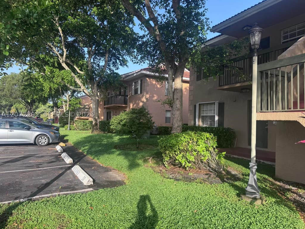 Photo of 10381 NW 8th St #102, Pembroke Pines, FL 33026 (MLS # A12072292)