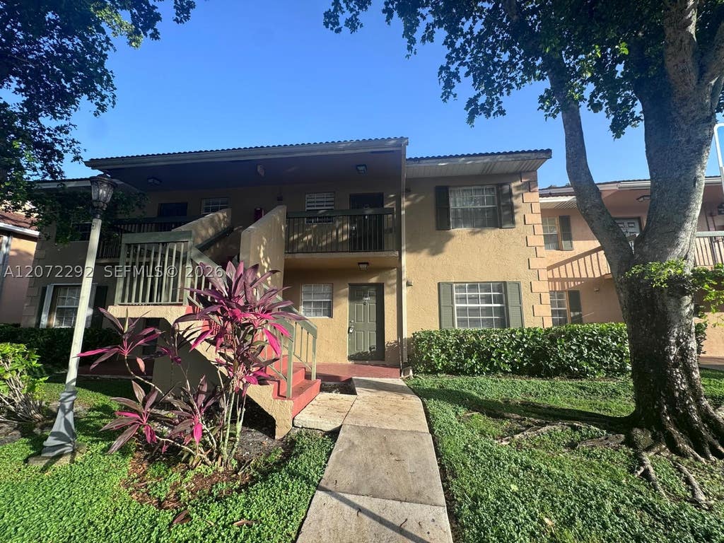 Photo of 10381 NW 8th St #102, Pembroke Pines, FL 33026 (MLS # A12072292)