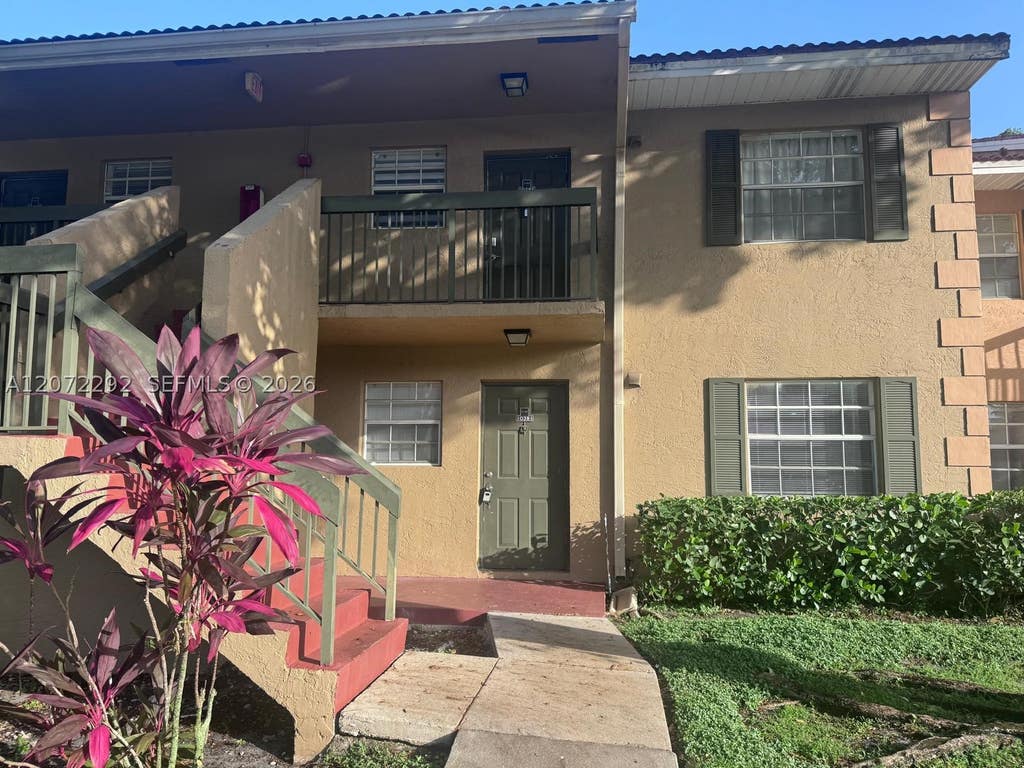 Photo of 10381 NW 8th St #102, Pembroke Pines, FL 33026 (MLS # A12072292)