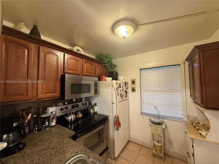 First Floor Condo with wood cabinets , Impact windows , Tankless water heater and other upgrades. Beautiful tranquil views from your florida room . This community offers great amenities like  Theater, Gym, Shows, Pool , Golf, water, cable, and so much more. Enjoy tea retirement you have been looking for.