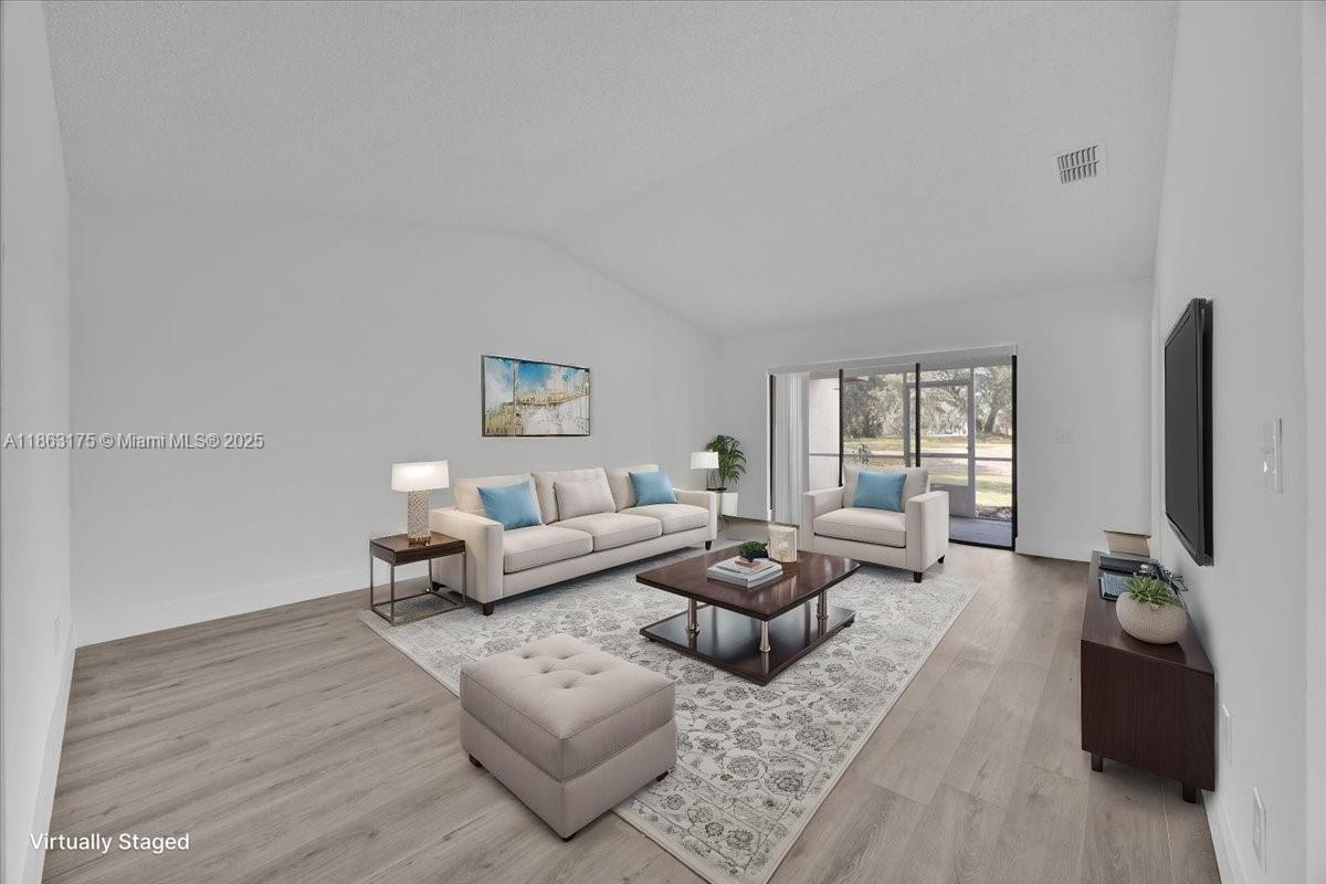 1230 SQFT, NEW ROOF (2025), NEW AC (2025), JUST RENOVATED VILLA IN 30 BUCK CIRCLE, HAINES CITY, FLORIDA. Just renovated 2 bedrooms 2 bathrooms Villa at the serene community of Villas of Sun Air. New modern floors 2025, new bathrooms 2025, new kitchen cabinets 2025, freshly painted! 1 car garage! Low monthly association fees. Beautiful screened-in patio to enjoy the fabulous Florida weather. Do not miss the opportunity to buy a home ready to move-in!
