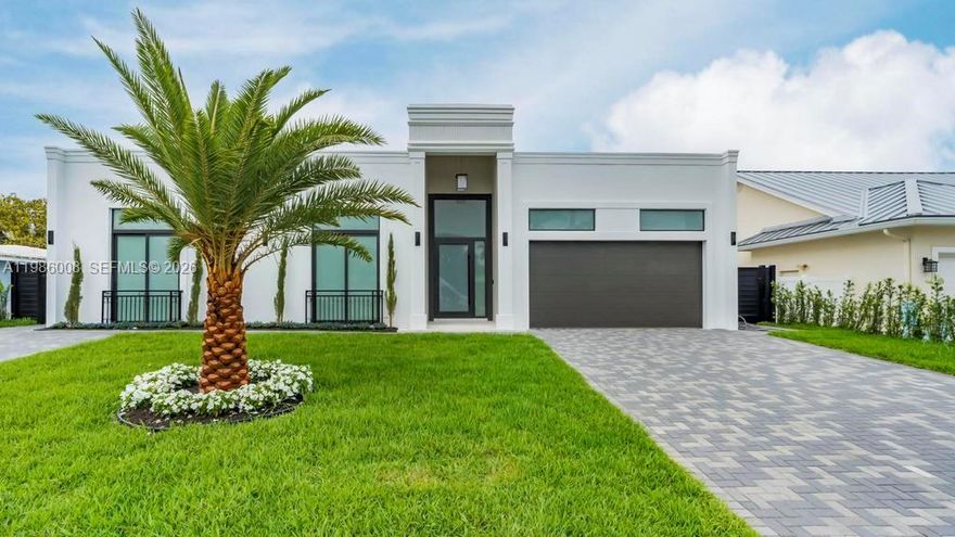 BRAND NEW CONSTRUCTION JUST BUILT 2026 in the desirable Lake Placid section of Lighthouse Point. This 4-bedroom plus office residence offers 3,831 total square feet (3,134 under air) with a two-car garage, 12-foot ceilings throughout and a 16-foot grand entry. The split floor plan features four ensuite bedrooms, including a spacious primary suite with dual walk-in closets. Finishes are thoughtfully selected, featuring Brazilian porcelain tile (Portobello), Brazilian tile bathrooms, Italian porcelain exterior accents, Spanish tile in the entry and outdoor areas, and custom thermally modified wood feature walls with a 20-year warranty. The kitchen is designed for both function and style, stunning Taj Mahal quartz counter-tops and backsplash with premium cabinetry, soft-close and touch-close systems. All walk-in closets are equipped with integrated LED lighting. Additional features include EV charging readiness and a fireplace. Outdoor living is complete with a private pool, outdoor shower, and a fully covered, equipped summer kitchen designed for entertaining. Frank McDonough Park is just minutes away, offering a baseball field, football/soccer field, sand volleyball court, racquetball courts, adult fitness equipment, clay tennis courts, the Lighthouse Point Tennis Center with pro shop and lessons, as well as a covered playground, picnic areas, and restrooms. Located less than 10 minutes from the Beach!