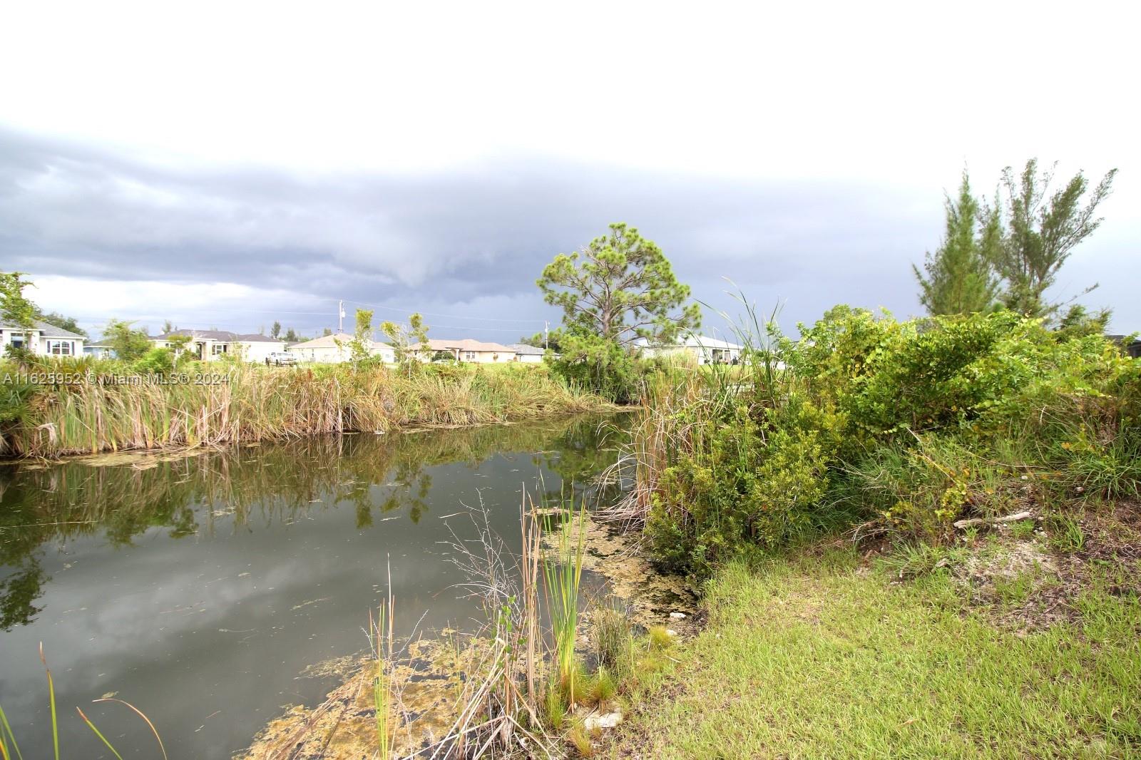 Don't miss out on this great opportunity to acquire an affordable lot with canal access. This large and beautiful waterfront lot is located in a prime area of Cape at Canal Chase. Situated in a tranquil, developing residential neighborhood where building is permitted, it offers serene waterfront views and the perfect setting for your dream home.