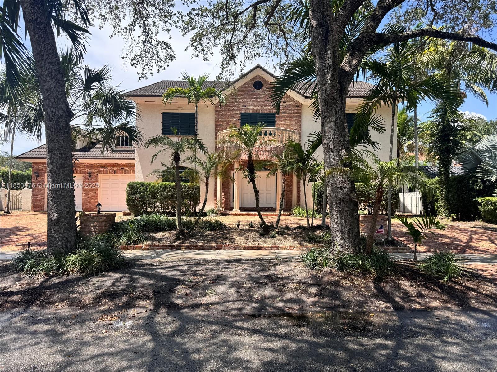 Timeless 4BR/4BA estate in Miami Lakes’ prestigious guard-gated Loch Lomond community. Features Old Chicago brick, classic shutters, and a columned portico. Over 5,200 sq ft of living space with a dramatic staircase and a striking floor to ceiling brick fireplace. Includes an open kitchen, formal dining room, spacious family room, and a first-floor guest suite with private bath. Enjoy a resort style backyard with pool, spa, and covered veranda. Two car garage and a metal roof. A rare opportunity in one of Miami Lakes’ most exclusive neighborhoods! Located just moments from Main Street shops, restaurants, golf courses, and top rated schools. A rare opportunity to own in a quiet, tree lined community with no HOA. Don’t miss out schedule your private tour today!