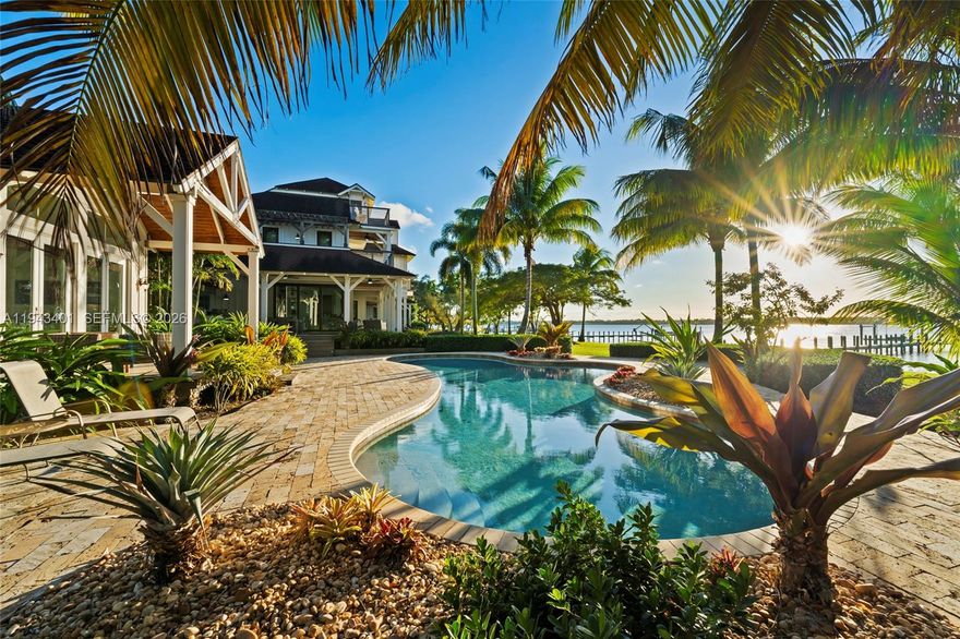 Set on more than 1.2 acres along a breathtaking stretch of riverfront in North River Shores, this exceptional home captures the essence of coastal Florida living. Designed for effortless entertaining and serene everyday living, the property offers sweeping sunset views, expansive outdoor spaces & a seamless connection to the water. 

A private 16 ft boat dock with 24k boat lift & dual jet ski lifts with no fixed bridges makes this home a boater’s dream, while the resort-style pool, tennis court (which easily could be converted to pickleball) & generous patios create the perfect backdrop for gatherings with family & friends. Mature landscaping & generous lot size provide a rare sense of privacy & tranquility not easily found in South Florida. 

Adding to the property’s appeal is a beautifully appointed guest cottage, ideal for extended stays, visitors, au pair or multi-generational living. This is a rare opportunity to own a refined riverfront estate where elegant entertaining, stunning sunsets & effortless access to the Atlantic Ocean come together in one of Florida’s most desirable coastal communities.

Additional features: impact glass windows & doors, architectural shingle with spray foam insulation, buried propane tank runs: stove in main kitchen, summer kitchen grill, 2 hot water heaters in main home & pool heater (new in 2023 Hayward heater), outside decking is Brazilian Hardwood, office with floor to ceiling built-ins.