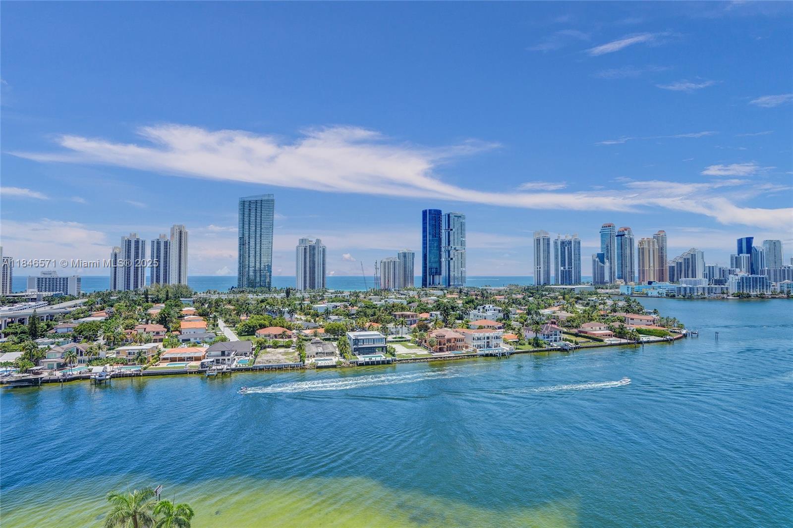 Experience luxury coastal living in this beautifully appointed 2 bedroom, 2.5 bathroom condo, ideally located in a premier full-service building with resort-style amenities and a private marina. Boasting sleek marble floors throughout, this light-filled residence offers sweeping views of both the intracoastal waterway and the sparkling Atlantic Ocean. Step into an open-concept living and dining area framed by floor to ceiling windows and a private balcony—perfect for watching the boats glide by or enjoying sunrise over the ocean. The spacious primary suite offers breathtaking water views, ample closet space, and a luxurious en-suite bath. A well-appointed second bedroom and full guest bathroom provide comfort and privacy for family or guests. Start living the coastal lifestyle you deserve!