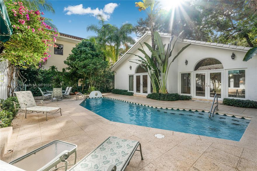 This one-of-a-kind beauty in prestigious south Coconut Grove offers a fabulous opportunity to live in one of the most desirable areas. Nestled within the Utopia homeowner's security association. The main house is a stunning 3 bedroom, 2.5 bath gem with soaring cathedral ceilings, the interior is light bright & open, offering breathtaking views of the lush outdoors and a sparkling heated pool. The guest house is equally impressive and features 2 bedrooms and 1 bath – spacious living/dining room with a kitchen with high ceilings and elegant wood floors. New roof, impact resistant windows and doors, and 2 car garage. Close to charming cafes, shops, bike paths, great schools and more.