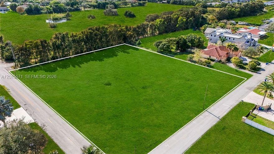 This property is to be sold with the lot next to it for a total of 1.86 acres. Rare opportunity to build in one of South Florida’s most coveted estate communities — Southwest Ranches. This corner lot offers the perfect canvas for a luxury custom estate, surrounded by newly built multimillion-dollar homes owned by residents seeking privacy and space without sacrificing convenience. The property is fully equipped for immediate development with underground electric, well, and septic already in place, plus city water available via the Davie Hawks Bluff Elementary line (buyer simply pays the hookup fee). No HOA. Design and build your dream estate, guest house, barns, or private compound exactly how you want. This premium corner location offers added privacy, multiple access points, and flexibility for architectural layout — ideal for a gated estate, circular drive, or multi-structure compound. Minutes from top private schools, equestrian facilities, major highways, and Miami-Fort Lauderdale’s elite dining, shopping, and entertainment, yet tucked inside one of the most exclusive low-density communities in Broward County. Home is AI generated.