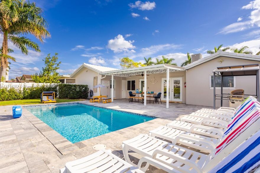 This is a short term Monthly/Weekly Rental.
Monthly rate $12,500.
Call agent for a Weekly  Availability and Rates

Fully Renovated, Luxury 5BR/3BA House with the New Heated Pool. Located in the heart of the Hollywood Lakes, one of the best destinations near Miami and Fort Lauderdale. 
Minutes from the Hollywood Beach & Boardwalk, Restaurants, Bars, Casinos, and more... 2700 sq. ft. luxury house can comfortably accommodate a large group of people for a luxurious stay that will have you coming back time and time again...