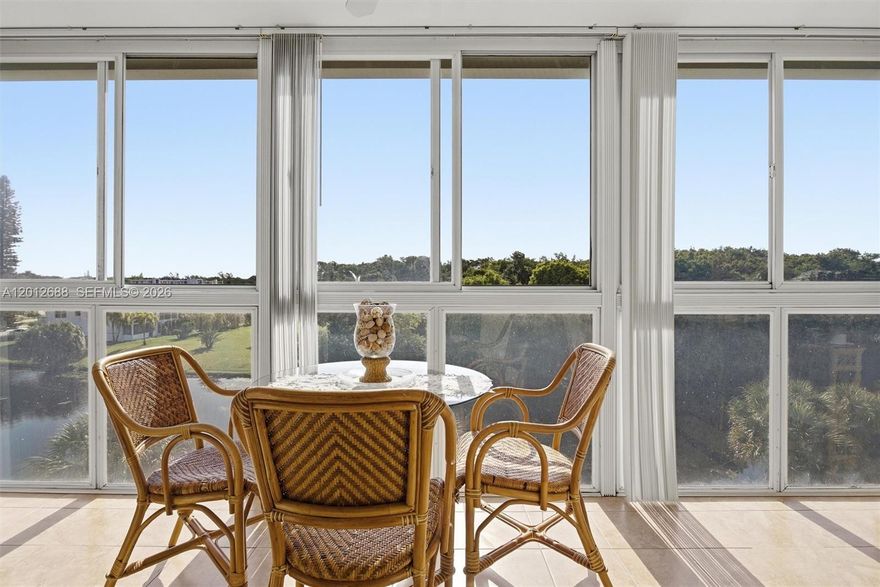 Lovely canal views from this beautifully renovated 1-bedroom, 2 full-bath condo in the desirable 55+ community of Century Village Deerfield Beach. Originally a 1.5-bath unit, the guest bath has been converted to a full bathroom for added convenience.  This unit is offered furnished and features a modern kitchen with granite countertops, tile backsplash, white shaker cabinets, stainless steel appliances, and recessed lighting. Open living areas are finished with tile flooring, while the bedroom features laminate. Additional upgrades include a replaced electrical panel, water heater, and A/C (2018).  Both bathrooms have been remodeled, with the primary bath offering a walk-in shower and glass enclosure. Enjoy relaxing canal and fountain views from the enclosed patio with sliding plexiglass windows. The building features a new roof and a BBQ/picnic area, perfect for entertaining. Century Village offers resort-style living with gated entry, 24-hour security, free transportation, multiple pools, tennis, pickleball, a fitness center, a theater, a café, and a wide variety of classes and clubs. Association claims 55+.
