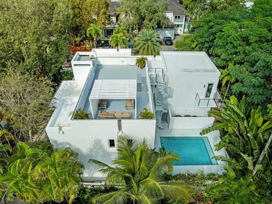 Discover your dream modern home in coveted Coconut Grove! This 3-bed, 3.5-bath, 3,385-square-foot residence features an open-concept design, gourmet kitchen, private pool, rooftop vistas, and ample parking for 7 vehicles. Each bedroom has an en-suite bath, and the master suite includes a walk-in closet, den, and terrace. Brand-new fencing, high-impact windows, and water filtration systems ensure privacy, security, and comfort. Don't miss this contemporary masterpiece on Battersea Road in Coconut Grove—modern living at its finest.