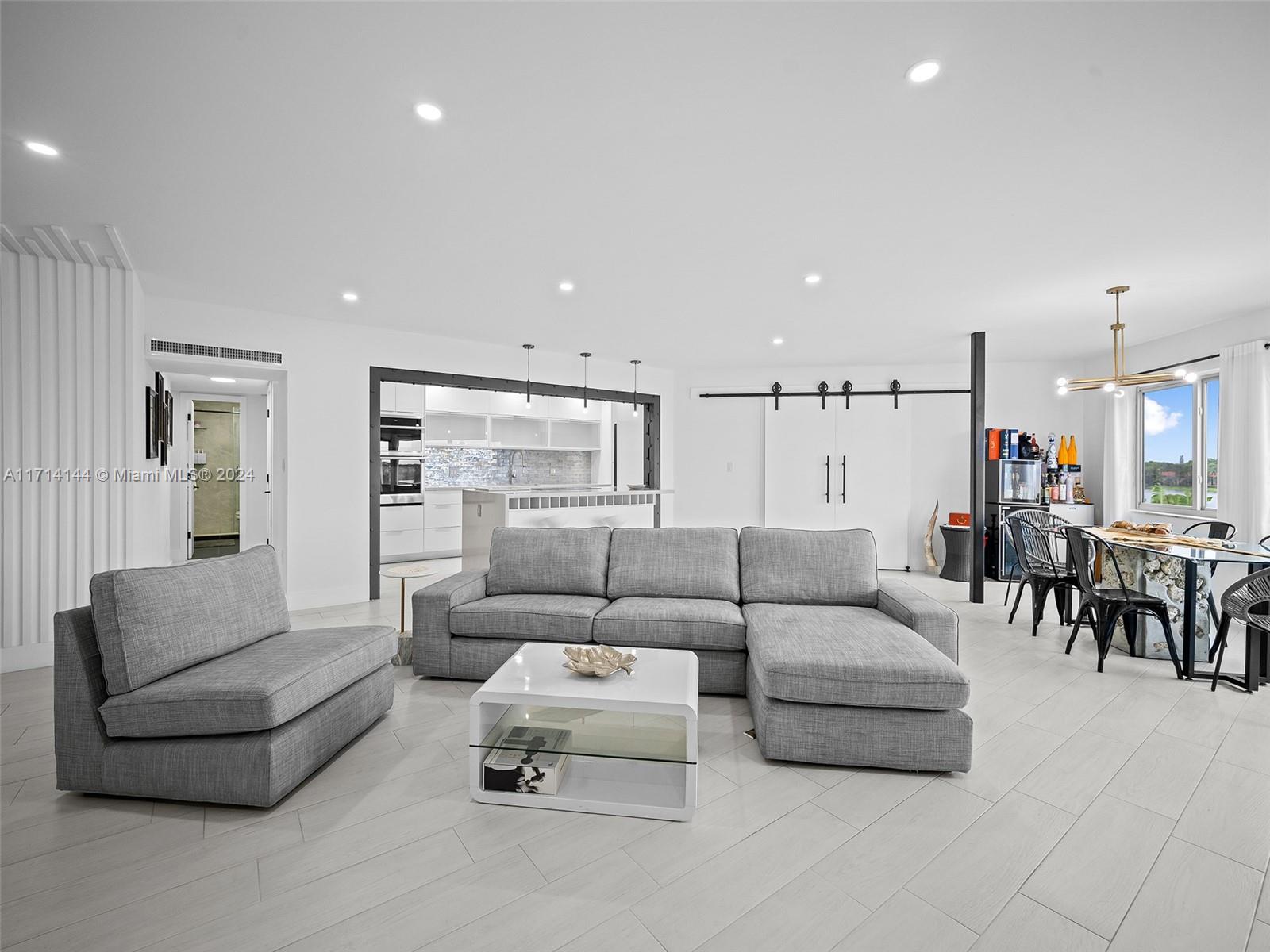 This very unique top-floor loft-style apartment offers 3 bedrooms plus an office (easily convertible into a 4th bedroom), with 2 full bathrooms. Open kitchen concept, induction cooktop & new appliances. Recent updates include a brand-new roof (2024) and hurricane-grade windows (2024). Enjoy breathtaking sunsets from your waterfront view, with serene lake surroundings that provide a calm escape from the city's hustle. The building offers gorgeous pool, a playroom with pool and table tennis, and a newly renovated gym. Conveniently located minutes from I-95, the Turnpike, and just 20 minutes to both downtown Miami and Fort Lauderdale, this location is also near Aventura Mall, perfect for shopping and dining. Available unfurnished. Ready to move in and make it your own!
