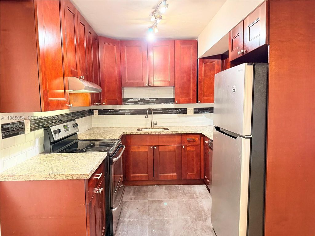 Photo of 11101 Royal Palm Blvd #204, Coral Springs, FL 33065 (MLS # A11965054)