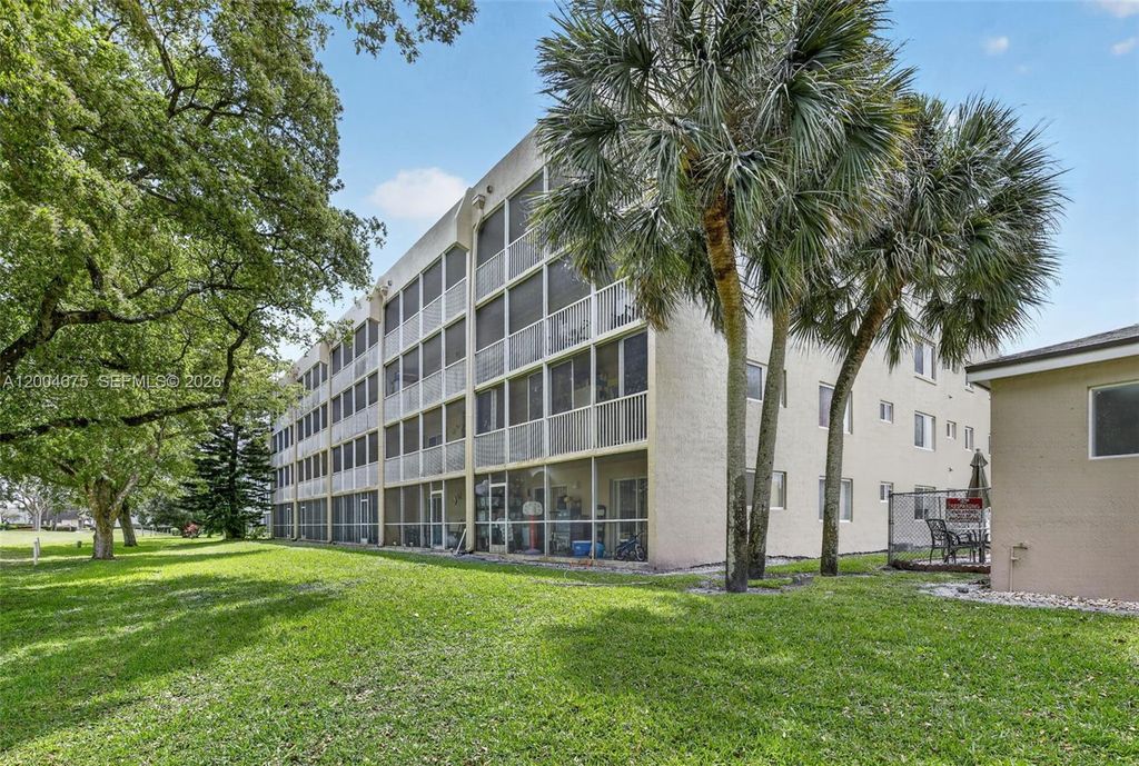 Photo of 9470 Tangerine Pl #105, Davie, FL 33324 (MLS # A12004675)