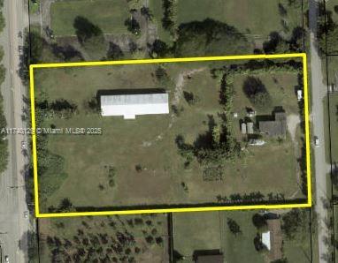 Don't miss this rare opportunity to own 4.55 acres in the highly desirable Horse Country—an idyllic rural retreat offering unparalleled access to both serene country living and the conveniences of urban life in Miami-Dade County! This property features a 2-bedroom, 1-bathroom single-family home with a spacious den that could serve as a third bedroom, perfect for remodeling, expansion, or development. It also includes a 16-stall horse stable with a 7-year-old roof, plus additional living quarters and bathrooms. The existing home provides financing options for single-family use, with endless potential for equestrian facilities, an estate, a mansion, or multi-use development according to local zoning regulations.