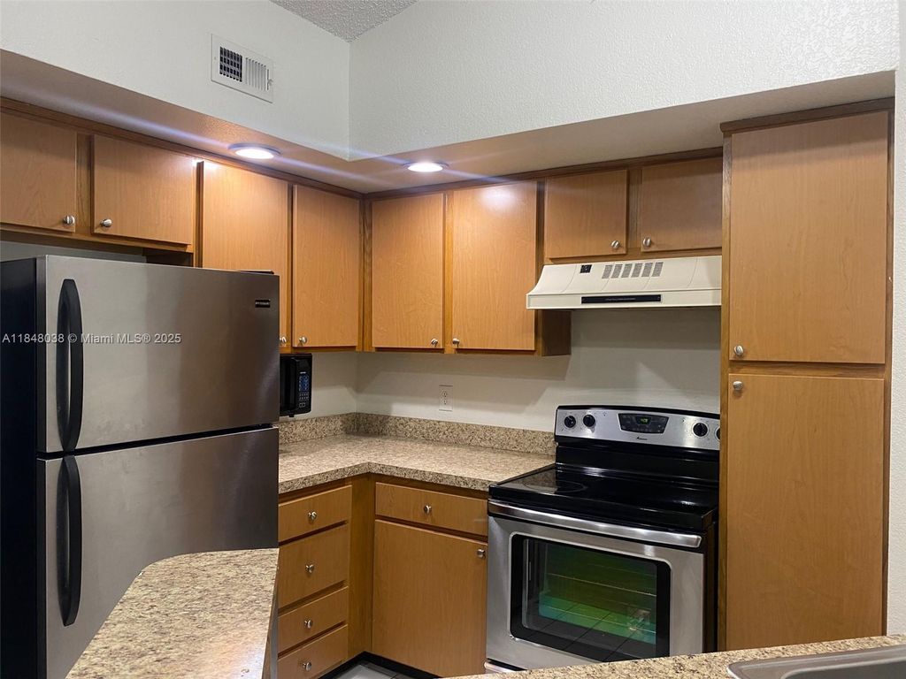 Photo of 12980 Vista Isles Dr #325, Sunrise, FL 33325 (MLS # A11848038)