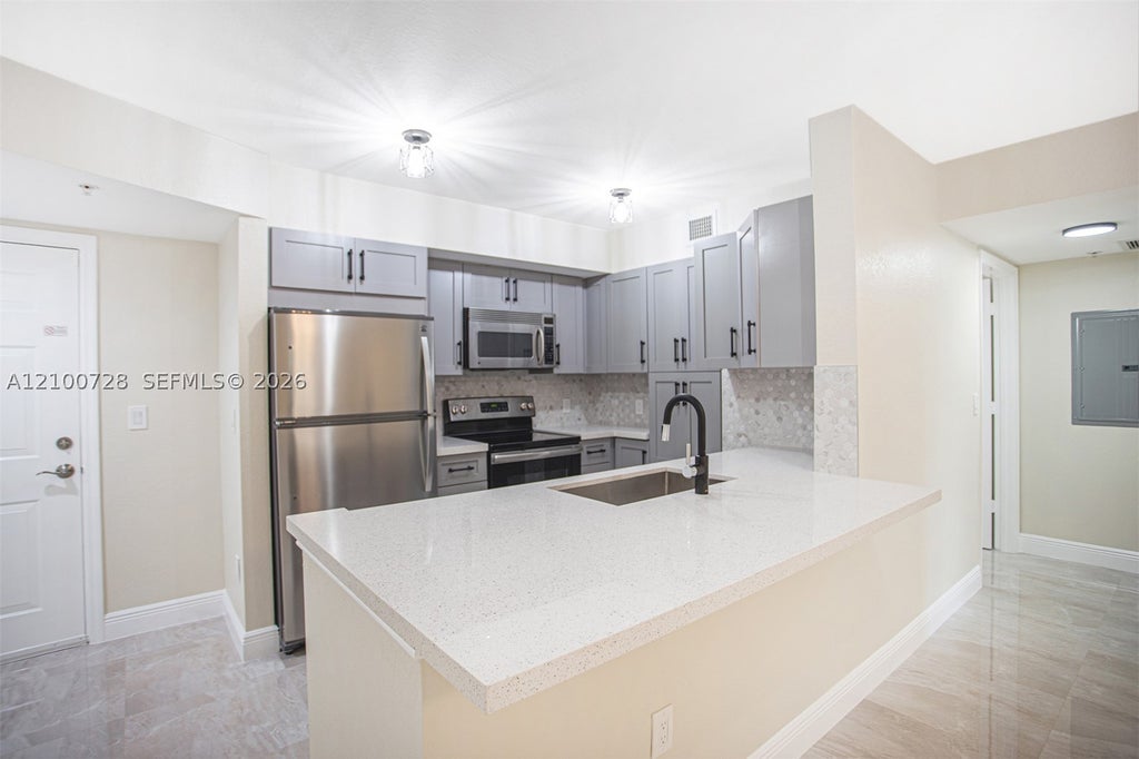 Photo of 6777 Heritage Grande #1206, Boynton Beach, FL 33437 (MLS # A12100728)
