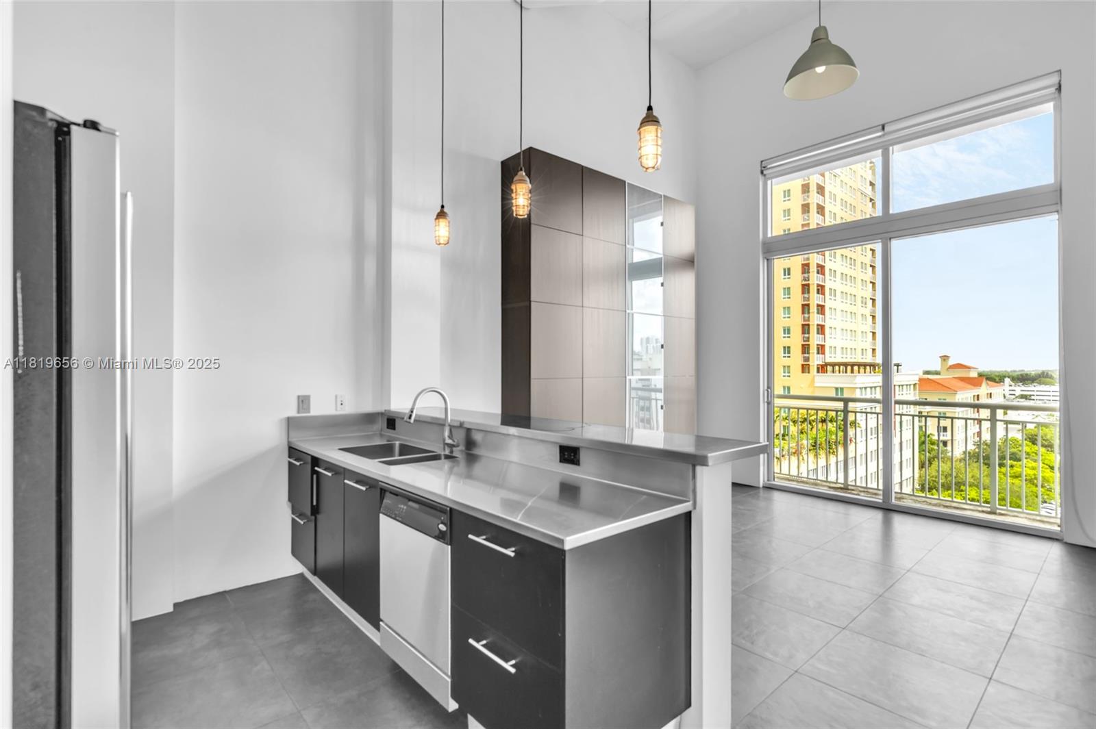 ***PRICE REDUCED!!!*** Modern, light-filled loft on the 7th floor with open kitchen, spacious dining area, city views, and high ceilings. Features include floor-to-ceiling windows, electric blackout shades, walk-in closet, full bath, and updated AC (2018). Includes 2 same-floor parking spots + 1 valet. Amenities: 2 pools, jacuzzi, sauna, club room, 2 gyms, 24-hr concierge, and valet. Walk to Dadeland Mall, Metro Station, and top restaurants.