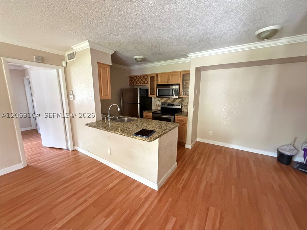 Photo of 721 NW 104th Ave #101, Pembroke Pines, FL 33026 (MLS # A12063164)