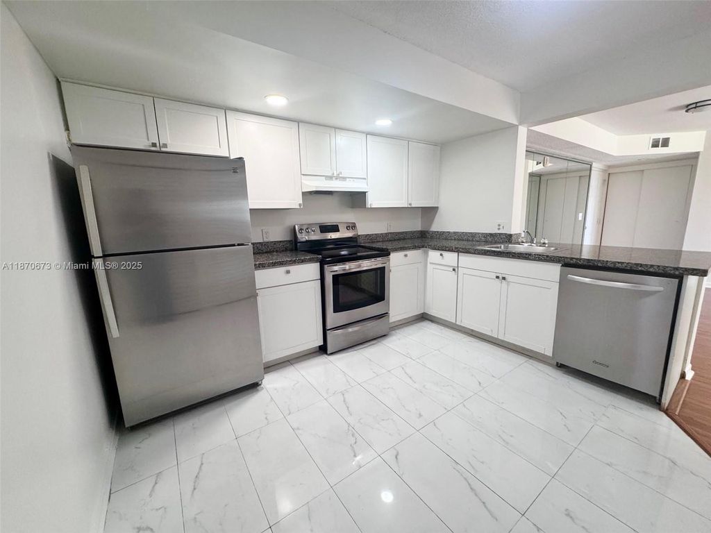 Photo of 5801 Riverside Dr #102B3, Coral Springs, FL 33067 (MLS # A11870673)