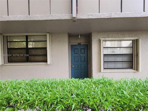 Photo of 900 Colony Point Cir #107, Pembroke Pines, FL 33026 (MLS # A12012354)