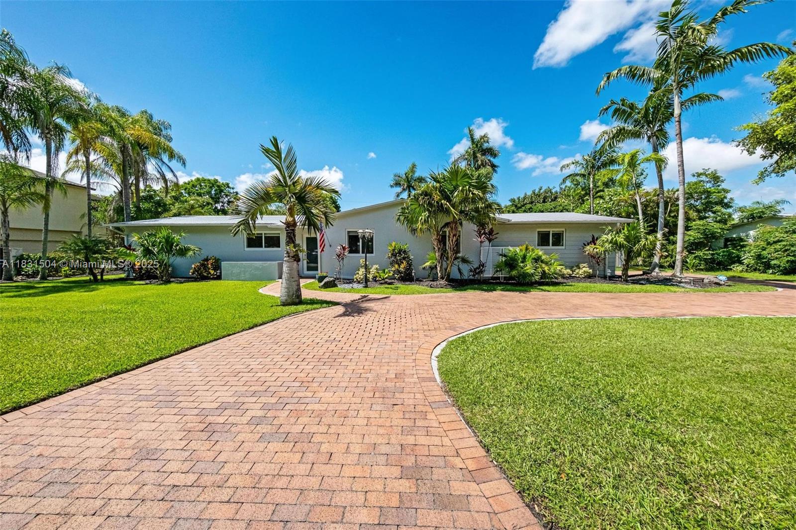 Welcome to this charming South Miami home nestled on a generous 14,800+ SF lot. The expansive backyard, surrounded by lush greenery and elegant palms, is perfect for outdoor living and entertaining. The spacious screened-in patio fully encloses the pool and outdoor area, complete with a built-in grill and summer kitchen. Inside, the kitchen has been fully remodeled with quartz countertops and a large kitchen island. The primary suite offers a large walk-in closet, dual sinks, and direct access to the outdoor patio. The garage has been converted into an in-law suite, and all bathrooms have been remodeled. Completing the home is a large driveway with ample parking for family and guests.