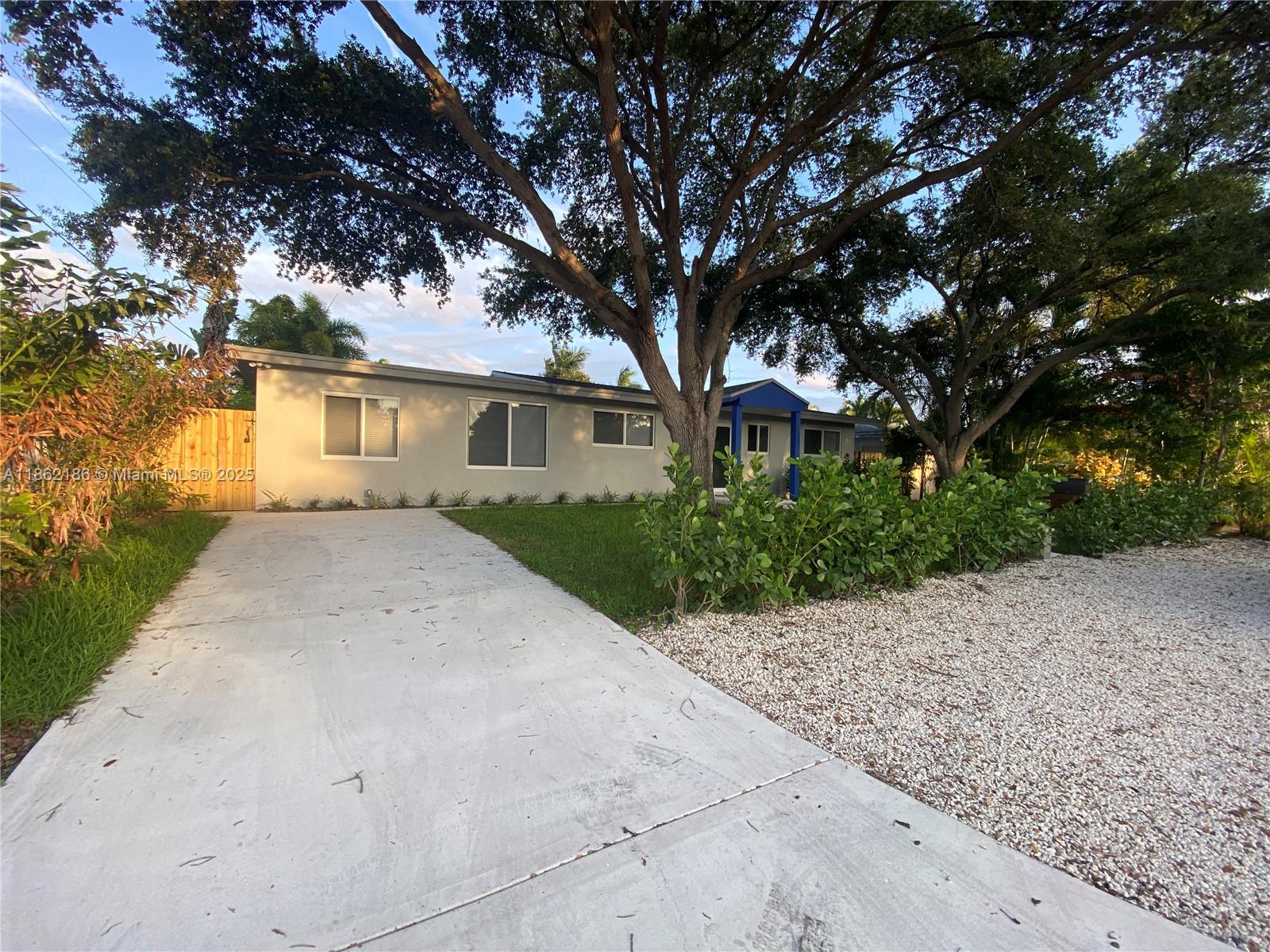Tastefully remodeled 3 bed / 2 bath home in desirable Wilton Manors. Features include 2022 roof, full impact windows & doors, updated electric panel, tankless water heater, and 2019 AC. Bright, open layout with recessed dimmable lighting, waterproof luxury vinyl plank flooring, and a modern kitchen with white cabinetry, quartz counters, and slate GE appliances. Additional sunroom offers abundant natural light and backyard views. Home also includes a formal dining room, utility room, and fully fenced yard. Conveniently located near I-95, downtown Wilton Manors, and just minutes to Ocean Drive & the beaches!