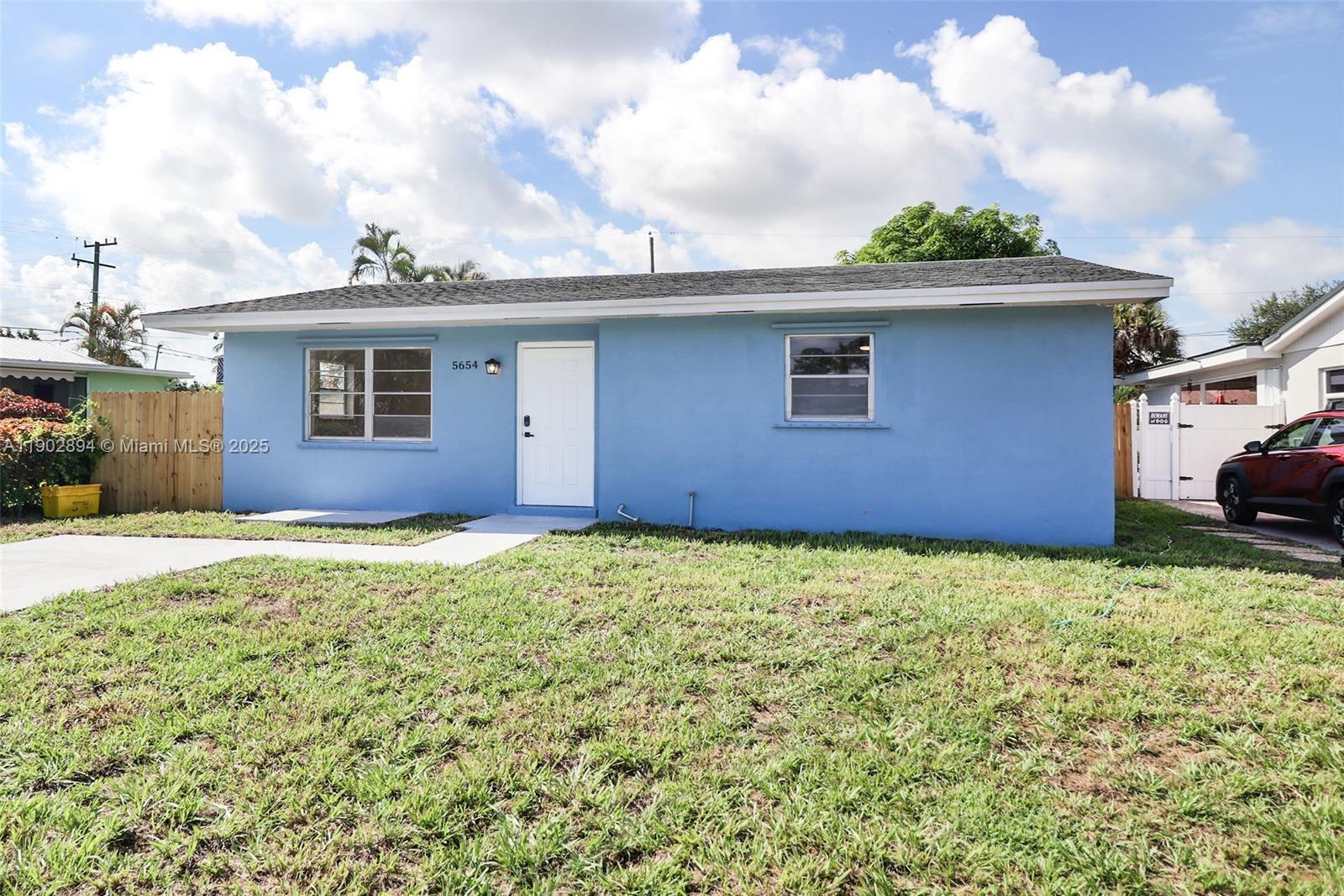 Don't miss this little jewel. Fully rehabbed with new kitchen, bathrooms, floors, stainless steel appliances, washer/dryer, private fenced patio with fruit trees; located in the heard of Palm Beach minutes from the Turnpike, surrounded by parks and recreational areas. Your family will love it ! Easy to show and ready to move in. Call now!
