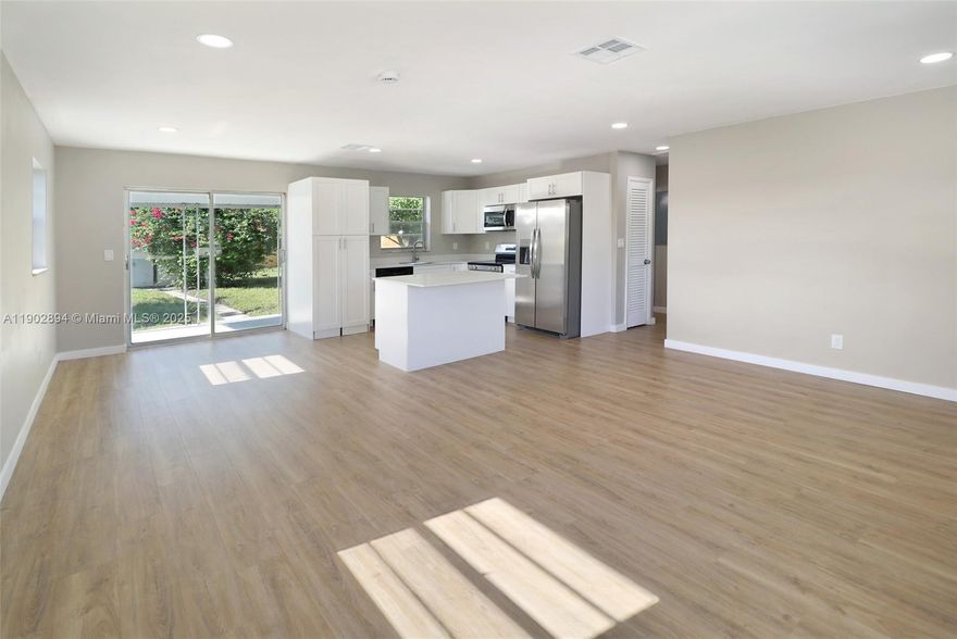 Don't miss this little jewel. Fully rehabbed with new kitchen, bathrooms, floors, stainless steel appliances, washer/dryer, private fenced patio with fruit trees; located in the heard of Palm Beach minutes from the Turnpike, surrounded by parks and recreational areas. Your family will love it ! Easy to show and ready to move in. Call now!