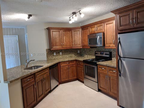 Photo of 4015 W Mcnab Rd #D210, Pompano Beach, FL 33069 (MLS # A12046006)