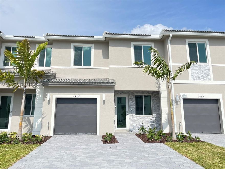 Welcome to this beautiful recently completed townhome (Smart Home). The home has 3 spacious bedrooms and 2 full bathrooms plus a half bathroom, adding space and comfort to your property, located close to the Florida City Outlets and at the entrance to the keys. Concrete Paver driveway, stainless steel appliances, the garage has space to store bicycles or everything you need. SS appliances adorns the kitchen, complemented by granite countertops. Hurricane Impact Garage Door, Windows & Doors throughout. Step outdoors to discover a generously proportioned fenced backyard, offering an ideal setting for familial gathering. This residence is ideally situated in proximity to premier shopping destinations, fine dining & prominent attractions. Community Clubhouse, Community Pool, nice GYM.