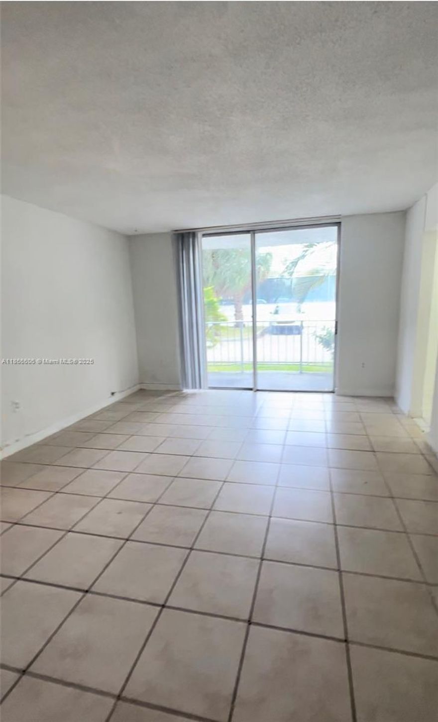 Nice condo and well located community. convenient unit 1st floor location with tile floors throughout. 2 Bed 2 Bath Community amenities such as swimming pool, gym, clubhouse, tennis courts, security guard 24/7 and gated doors. One parking space is included (additional parking spaces can be rented from the building). Laundry facilities on each floor. Unit is rented until 10/31/2026 need 24hrs notice for showing