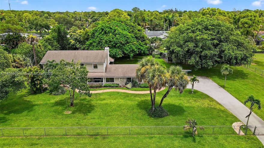 YOUR WAIT IS OVER.... 4 Bedroom + Office/Den, 3.5 Bath, Pool Estate, on a 1 Acre Lot in Sought-After PALM BEACH RANCHETTES. Features an Inviting Floor Plan, Renovated Kitchen, Grey Shaker Cabinetry, Quartz Countertops, Subway Tile Backsplash, Island, Stainless Steel Appliances, Beverage Chiller, Pantry and Serving Bar, Spacious 2nd Floor Master Suite w/Sitting Area, Walk-in California Closet, Dual Vanities, Roman Soaking Tub, Shower, Generous Guest Rooms, Utility Room, Custom Dog Wash, Tile & Laminate Flooring Throughout, Majestic Screened-in Gazabo w/Freestanding Jacuzzi Spa, Refreshing Freeform Pool, Pavered Patio, Accordion Shutters & Impact Windows, Storage Shed, Oversized Driveway, Fenced Grounds and Lush Landscaping. ***NO HOA*** On City Water & Septic. Ideally located!!!