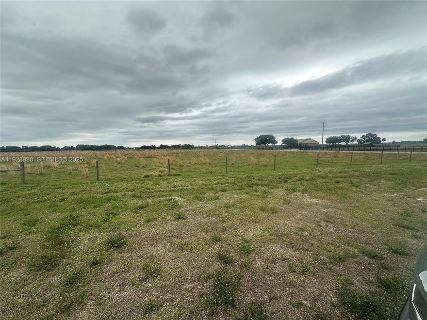 Seller Financing Available, Breathe in the fresh country air and make this beautiful property your home. A rare opportunity to own 20 pristine, fully fenced acres of agricultural land in the heart of Okeechobee’s highly desirable ranch country. Located on a quiet paved county road, this property offers the perfect blend of privacy, accessibility, and usable land.  The acreage is high and dry, ideal for cattle, horses, livestock, and a private homestead. A man-made pond adds functionality. The property also includes a 30' x 45' x 12' metal building, certified to 140 MPH, featuring two 10' x 10' roll-up doors and a 30' x 80' walk-in door, providing excellent storage and utility space. With AG zoning, the opportunities are wide open—whether you envision a working ranch, weekend retreat, family compound, prepper sanctuary, or peaceful country residence. Mobile homes, manufactured homes, barndominiums, and site-built homes are permitted, offering maximum flexibility for your preferred lifestyle and budget. Utilities include electricity and a well already in place. Septic is allowed (not yet installed). The surrounding area is made up of well-maintained mini-ranches and homesteads, offering a true rural community, within a comfortable drive to town conveniences. No wetlands. County may allow the property to be split into two 10-acre parcels, excellent opportunity multi-generational families. This is a property for those who value land, freedom, nature, and long-term investment.