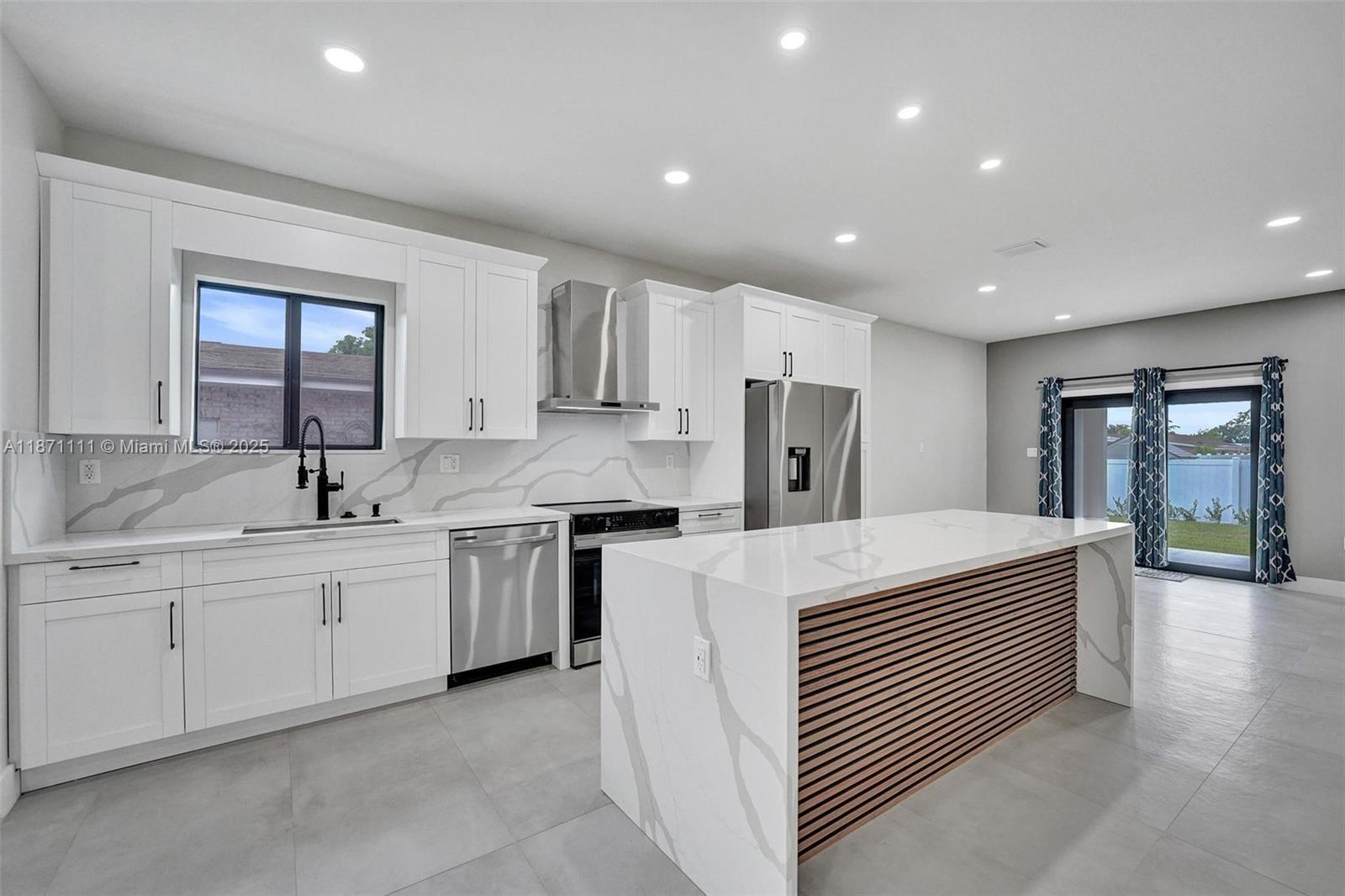 Stunning new construction minutes to the beach, Hard Rock Hotel & Casino, Hard Rock Stadium & Gulfstream Park. Designer-finished 4BR/3BA features an open-concept split plan, sleek porcelain tile, impact windows/doors & custom closets. Chef's kitchen showcases a quartz waterfall island & stainless steel appliances. Luxe primary suite offers an oversized custom closet & spa bath w/ separate shower & soaking tub. Two tankless water heaters. Expansive 432-sq-ft lanai extends living—ideal for entertaining. Large fenced yard w/ irrigation & room for a pool. 1-car garage w/ its own A/C for multipurpose use. No HOA! Not in a flood zone. Close to the airport for easy travel—central to beaches, stadiums, shops, dining, nightlife. Ask about $5,000 toward buyer's closing costs! Hurry, won't last!!!