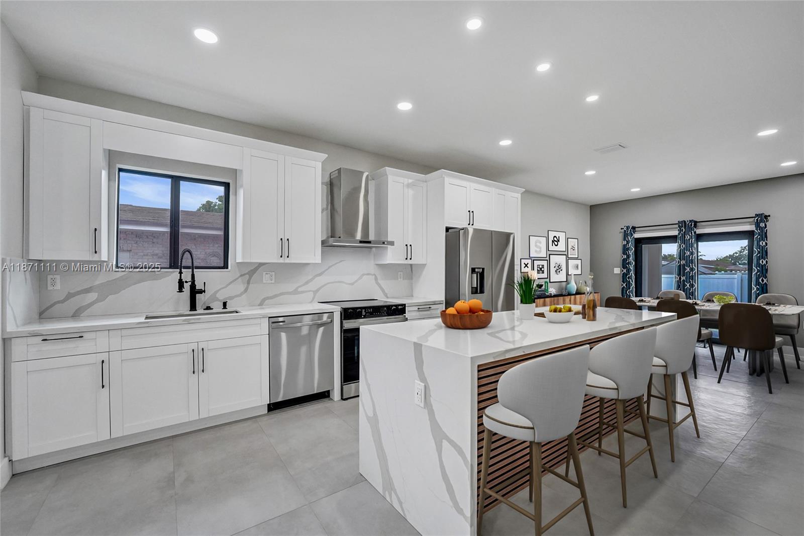 Stunning new construction minutes to the beach, Hard Rock Hotel & Casino, Hard Rock Stadium & Gulfstream Park. Designer-finished 4BR/3BA features an open-concept split plan, sleek porcelain tile, impact windows/doors & custom closets. Chef's kitchen showcases a quartz waterfall island & stainless steel appliances. Luxe primary suite offers an oversized custom closet & spa bath w/ separate shower & soaking tub. Two tankless water heaters. Expansive 432-sq-ft lanai extends living—ideal for entertaining. Large fenced yard w/ irrigation & room for a pool. 1-car garage w/ its own A/C for multipurpose use. No HOA! Not in a flood zone. Close to the airport for easy travel—central to beaches, stadiums, shops, dining, nightlife. Ask about $5,000 toward buyer's closing costs! Hurry, won't last!!!
