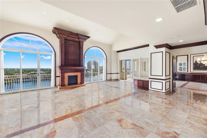 Expansive space with over 5000 sq feet to create your new home in the sky! Marble floors throughout, floor to ceiling windows with gorgeous water views from every room. The living area features, cathedral ceilings, 2 oversized arched windows, decorative fireplace, and wet bar. Formal living room and formal dining room with built in buffet and beautiful chandelier. Each room has balcony access. Kitchen with granite island, Snaidero cabinetry, gas range stove, double oven, Sub Zero refrigerator, breakfast nook, and large pantry. Oversized master bedroom with private balcony and wet bar, his/her bathrooms and 2 extra large walk in closets. The condo has 2 floors with an apartment/suite & exta storage located on the upper level.