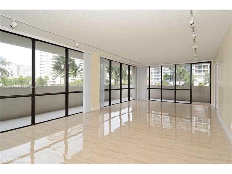 CROSS THE STREET AND YOU ARE ON THE BEACH ON A1A! TOTALLY UPDATED CORNER WRAP UNIT 2 BEDROOMS PLUS DEN WITH FRENCH DOORS CAN BE 3RD BDRM. PORCELAIN FLOORS THROUGHOUT, TOP OF THE LINE MODERN FINISHES. 5-STAR AMENITIES - MODERN GYM, POOL TENNIS AND BBQ ON THE INTRACOASTAL SIDE, RESORT LIVING ALL YEAR ROUND, WITH GUARD GATE AND LOBBY ATTENDANT INCLUDED. MINUTES TO AVENTURA MALL AND BAL HARBOUR, CASINOS, EXPRESSWAYS AND AIRPORTS. INVESTORS' DREAM: EXCELLENT LONG TERM TENANTS PAYING $3,000 A MONTH LEASE UNTIL JULY 31, 2025. SHOWINGS WITH ADVANCE NOTICE. DO NOT DISTURB THE TENANTS . VERY LOW HOA FEES , BOARD MANAGED BUILDING WITH OUTSTANDING MANAGEMENT AND FINANCIALS.