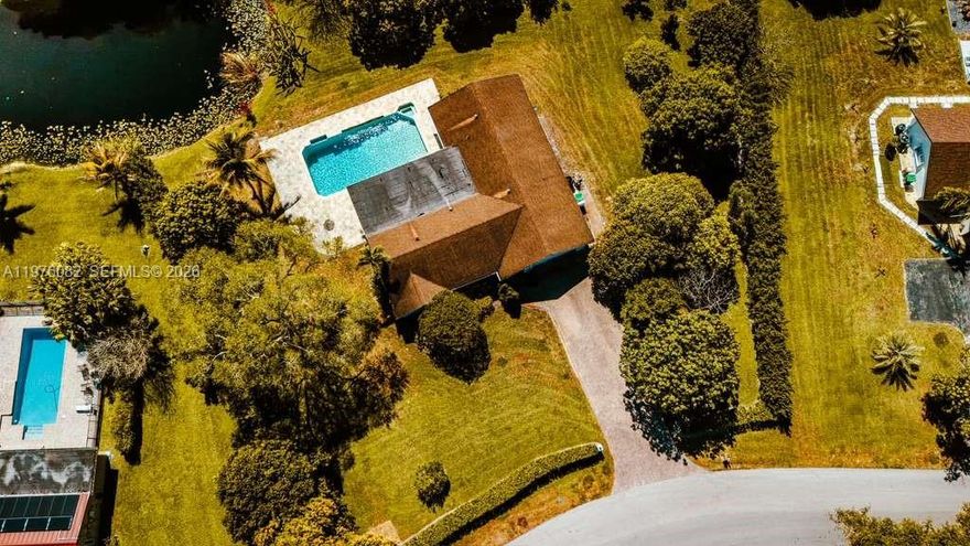 Beautiful house updated 3-bedroom, 2-bath modern home in the heart of Davie. This open-concept residence features elegant dark wood floors, a sleek chef’s kitchen with a large waterfall island, top appliances: Wolf Gas Range, Sub-Zero Refrigerator and Miele Dehydrator, bright living areas ideal for entertaining. Enjoy seamless indoor-outdoor living with a covered patio overlooking a sparkling pool, spa, and lush tropical landscaping. Perfectly located near top schools, parks, and shopping—move-in ready and designed for comfort and style.