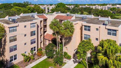 Photo of 9441 Live Oak Pl #104, Davie, FL 33324 (MLS # A11624952)