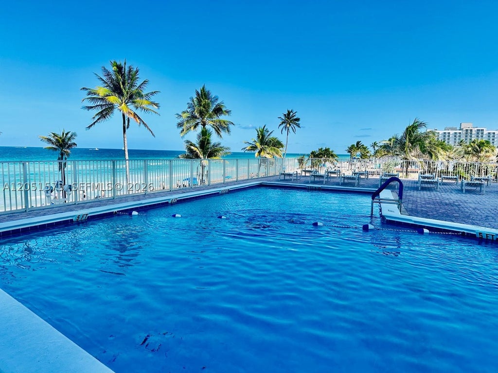 Photo of 3111 N Ocean Dr #401, Hollywood, FL 33019 (MLS # A12051573)