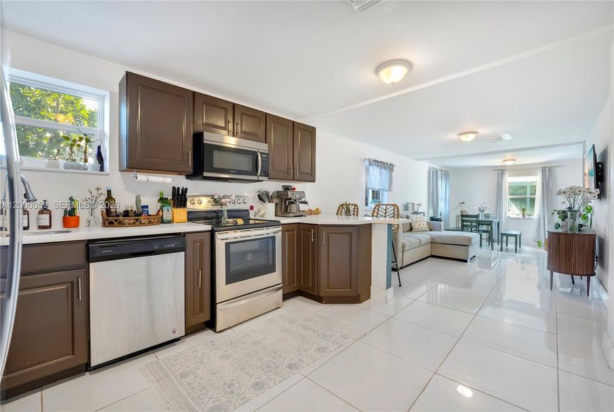 Step into this beautifully remodeled 3-bedroom, 2.5-bathroom home, completely updated in 2021. Electrical, most plumbing, roof, and impact windows were all upgraded in 2021, offering peace of mind for years to come. The bright open layout is filled with natural light, and the stunning kitchen features quartz countertops and 2021 stainless steel appliances. Enjoy the convenience of a dedicated laundry room and well-designed living spaces, including generously sized bedrooms and bathrooms. Situated on a spacious 7,000 sq ft lot, the property offers plenty of outdoor space for relaxing or entertaining. Ideally located just minutes from I-95, Miami Shores, Publix, this home delivers comfort and exceptional convenience. Perfect for buyers seeking a move-in-ready property!