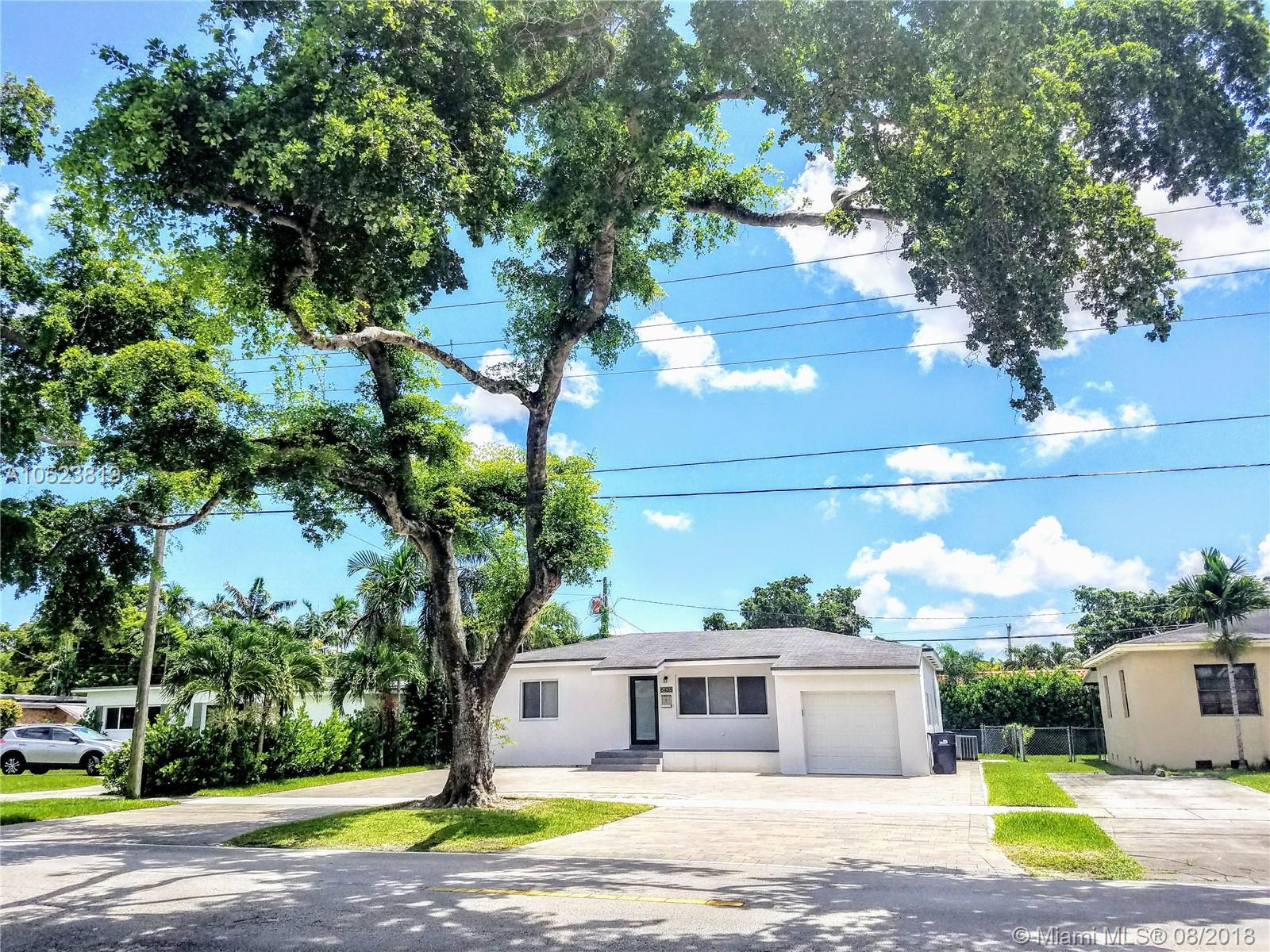 Beautiful West Miami Modern Home on tree-lined street. Completely and tastefully renovated from bottom to top! 2 Bedrooms each with custom closet.One Spa inspired bathroom, new cabinets,glass shower, bidet-toilet combo.Ceramic tile"wood plank"floors, lots of natural light flows into every room thru the new impact windows.Spacious living room and dining room.Great for entertaining. New custom kitchen impeccable cabinetry,Stainless steel appliances, wine cooler,5 burner glass range, convection oven and microwave. Relax in TV/Family Room with custom closet.Enjoy Miami's great year-round weather, dine or relax in your tropical private fenced backyard retreat! New,Key-less entry garage door,washer/dryer, water heater. Also NEW A/C ducts and unit. No Smoking nor Pets allowed .