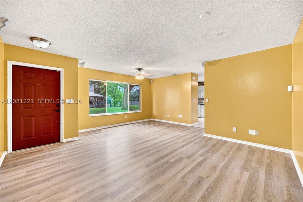 Photo of 1533 W Harmony Lake Cir, Davie, FL 33324 (MLS # A12081221)