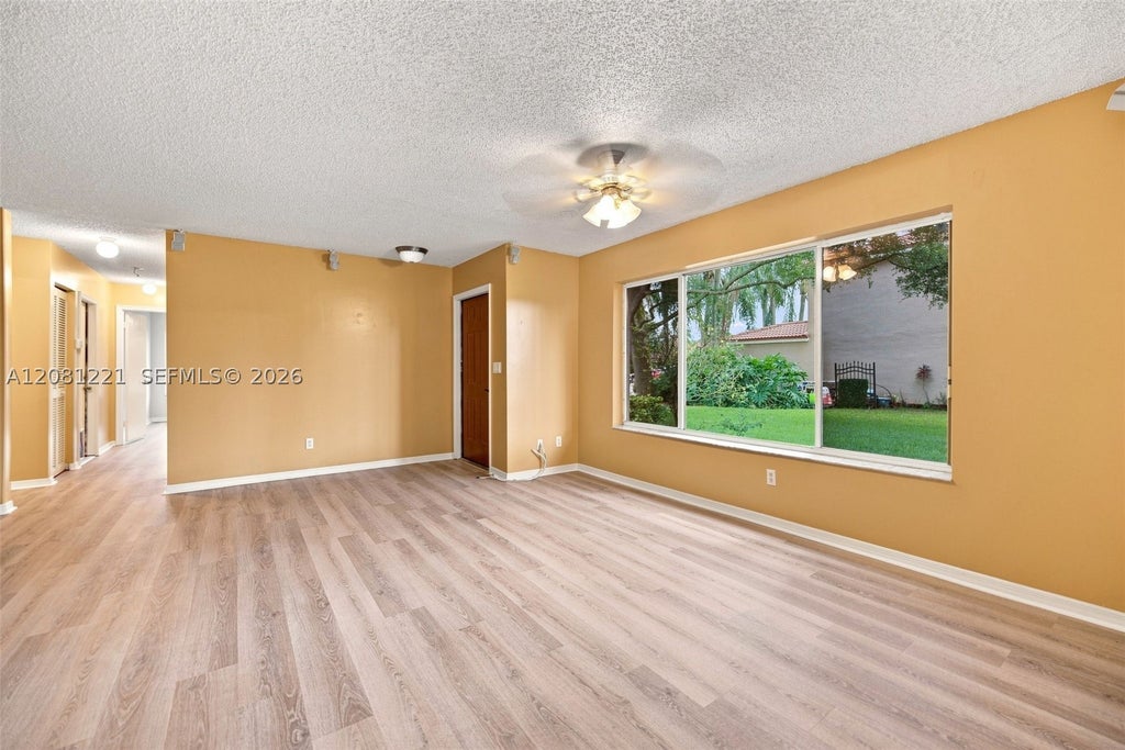 Photo of 1533 W Harmony Lake Cir, Davie, FL 33324 (MLS # A12081221)
