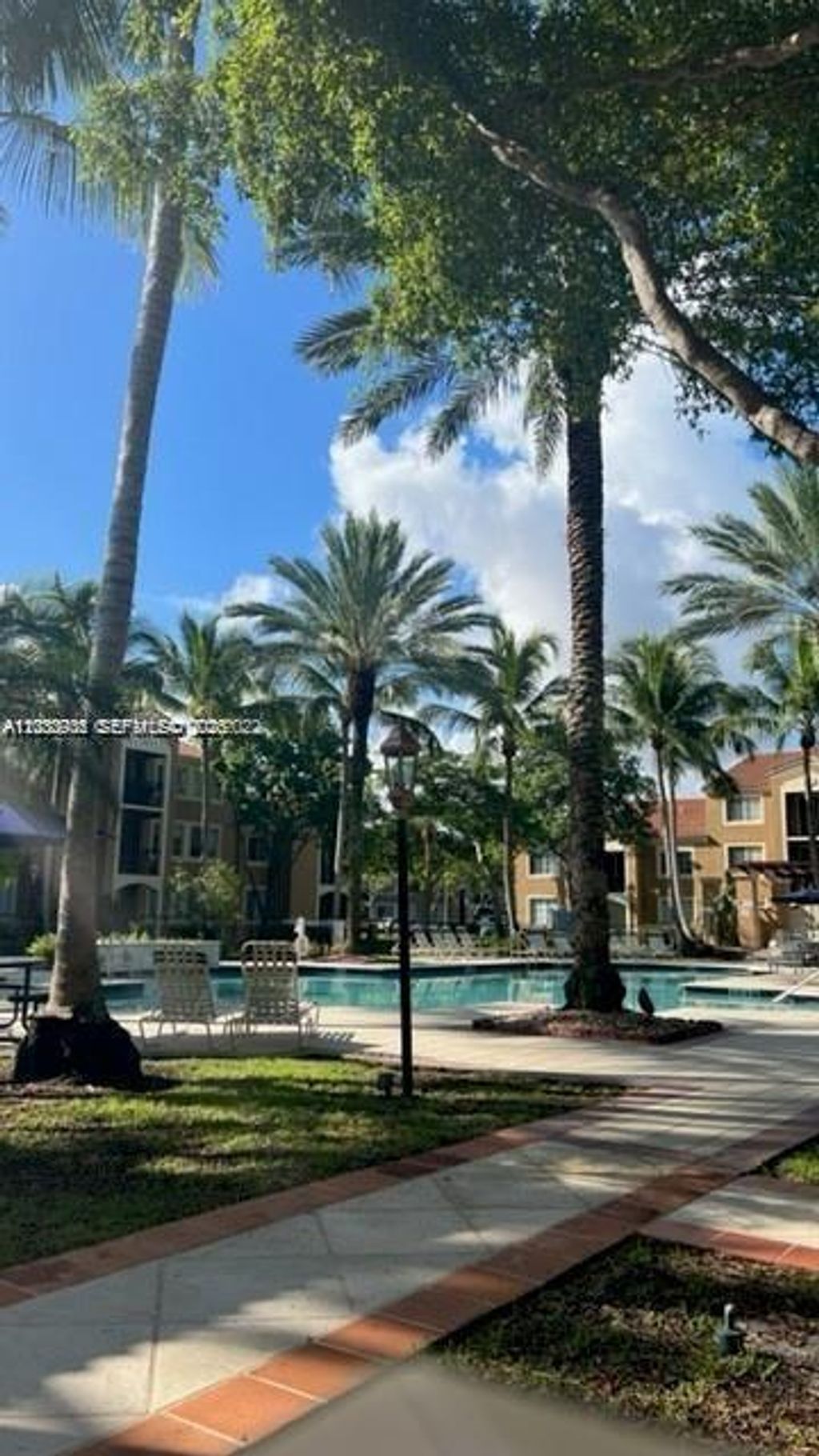 Photo of 8020 N Nob Hill Rd #205, Tamarac, FL 33321 (MLS # A12030936)